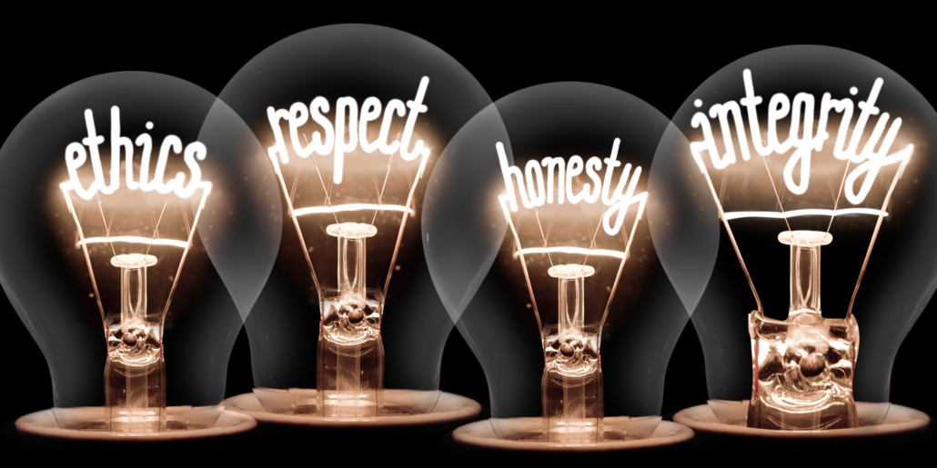 Integrity Wealth Advisors: ethics, respect, honesty, and integrity written on light bulbs